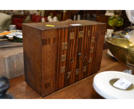An Art Deco oak cased two hole mantel clock 