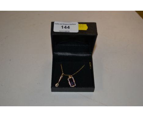 A 9ct gold mounted ruby set pendant and gold spoon on 9ct gold chain 