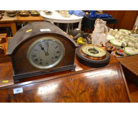 An oak two hole mantel clock; and an oak cased barometer 