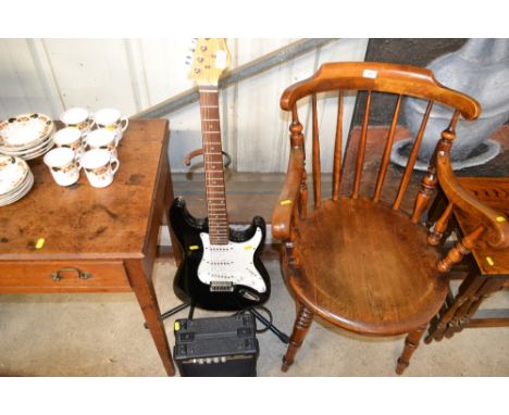 An Elevation electric guitar on stand; together with an Elevation amplifier