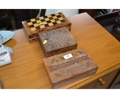 Two Indian hardwood trinket boxes and a boxed chess set and board 