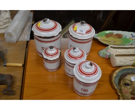 A graduated set of five French enamel storage jars 