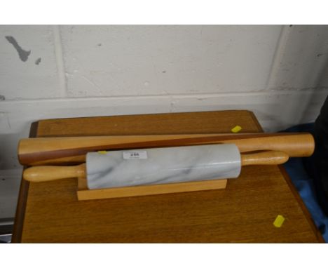 A marble rolling pin in stand, and a hard wood rolling pin 