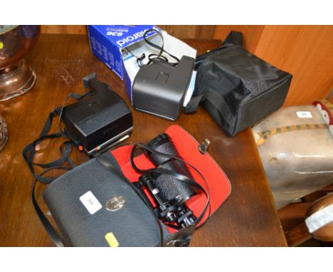 Two Polaroid cameras and a pair of binoculars 