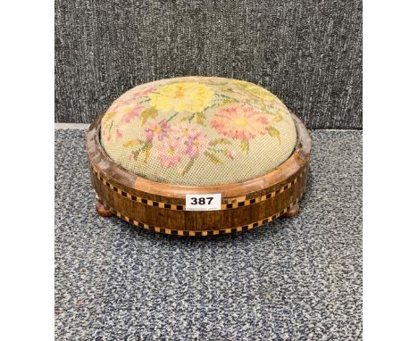 A tapestry upholstered inlaid footstool, Dia. 29cm.