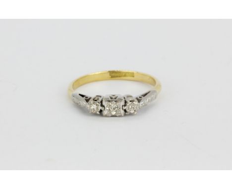 An 18ct yellow gold and platinum three diamond set ring, (R).