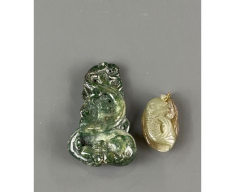 A 19th / early 20th C Chinese carved jade pendant, H. 5.5cm, together with a carved pebbled jade fish pendant.