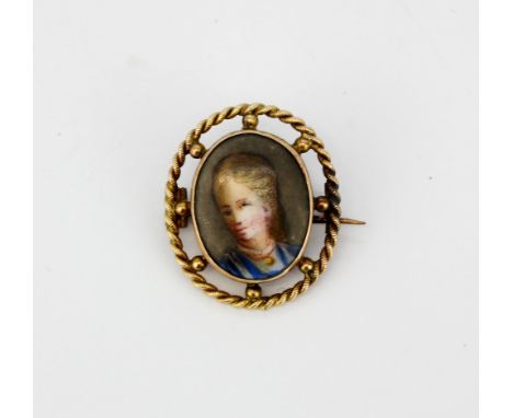 A 9ct yellow gold mounted miniature porcelain portrait of a young women, L. 2.2cm.
