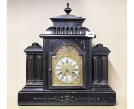 A Victorian ebonized wooden mantel clock with gilt brass dial, H. 47cm. W. 43cm.