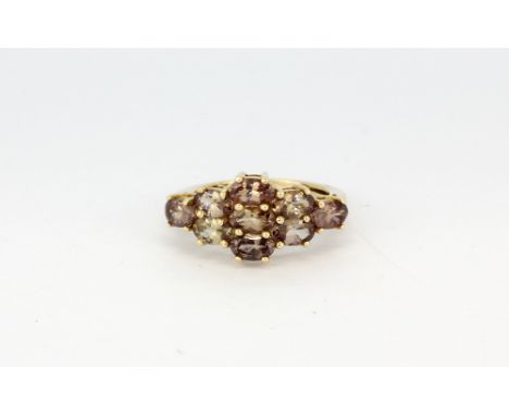 A 9ct gold cluster ring set with smokey quartz (K). Weight - approx. 3.1gr.&nbsp;