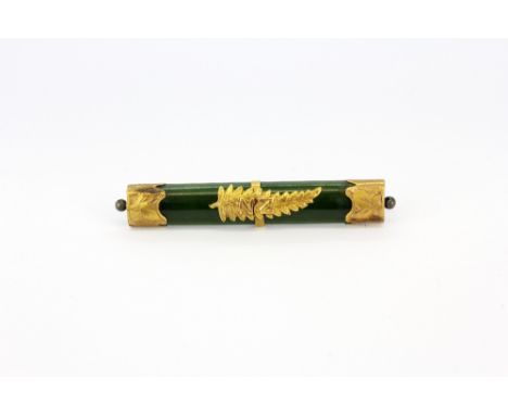 A antique yellow metal mounted New Zealand 'Green stone' (nephrite jade) brooch tested minimum 9ct gold, L. 6cm.