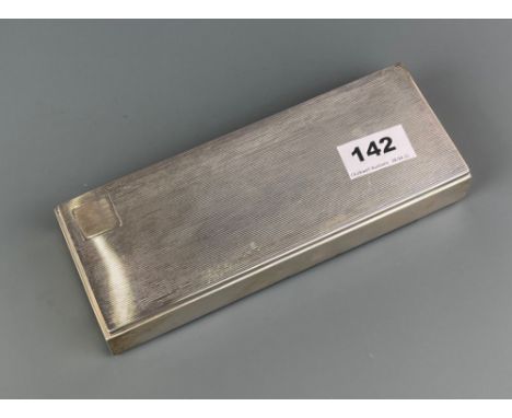 A Danish hallmarked silver cigarette box with engine turned decoration, 21 x 8 x 3cm.