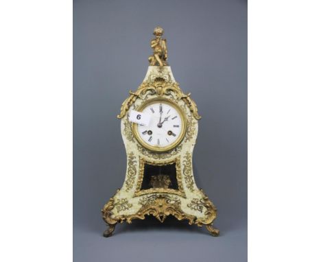 A wooden gilt metal and faux mother of pearl mantel clock by Berger of Paris, H. 41cm.