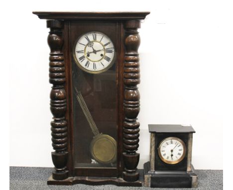 An slate and marble mantel clock and a wall clock.