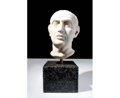 Ca. AD 50 - 200 .A Roman marble head of an elderly man, possibly general. The facial features are well marked, with a fleshy 