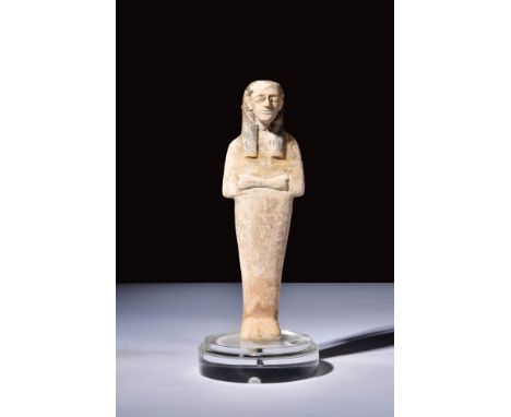 New Kingdom, Ca. 1550 - 1069 BC.A limestone ushabti, funerary figurine, shaped like a mummy with folded hands, symbolising se