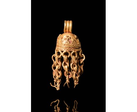 Ca. AD 100 - 200.A Parthian 20 ct gold pendant with suspension loop. The pendant has a large openwork semi spherical section 