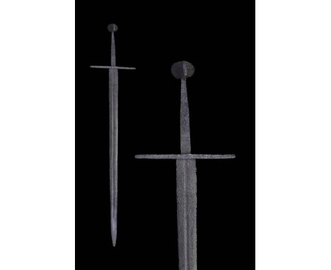 Ca. AD 1250 - 1520.This fine Medieval sword features a pommel of an unusual design. It is circular when viewed from the front