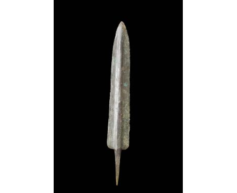 Western Asiatic/Aegan, Ca. 1200 - 700 BC.A bronze spearhead boasts a double-edged blade with parallel sides, skillfully taper