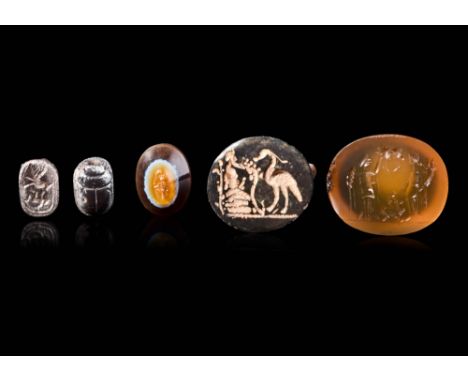 Ca. AD 200 - 300.A collection comprising a Roman agate trunconial intaglio depicting Hecate (Ca. AD 200-300); an Eastern Medi