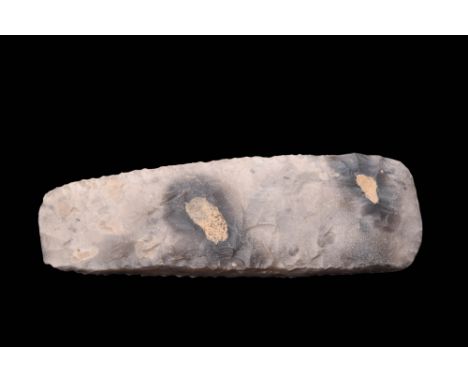 Ca. 8000 - 6000 BC.A neolithic flint axe, crafted through the process of knapping, displays a distinctively greyish hue, poss