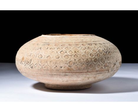 Ca. 2500 BC.A terracotta vessel characterised by a ring base, a flattened rounded body, and a short raised rim. The mid-secti