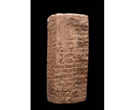 Ca. 1900 BC.A ceramic prism tablet with sharp edges and corners. Cuneiform is visible on most of the sides. Tablets in this s