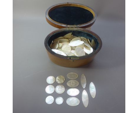 A late 19th century  satinwood tea caddy containing a large quantity of mother of pearl counters. H.13cm