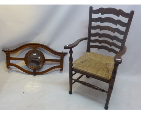 Early 20th century oak open arm chair, ladder back and rush seat on turned support, together with oak hanging coat rack, with