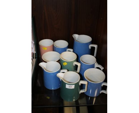 A COLLECTION OF ANTIQUE AND VINTAGE CERAMIC JUGS AND MEASURES