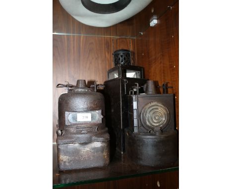 AN LMS RAILWAY LAMP TOGETHER WITH ANOTHER PLUS A BOXED TRIANGULAR LANTERN