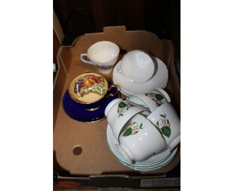 AN AYNSLEY CUP AND SAUCER WITH ORCHARD GOLD INTERIOR TOGETHER WITH SIX ASSORTED SHELLEY CUPS AND SAUCERS