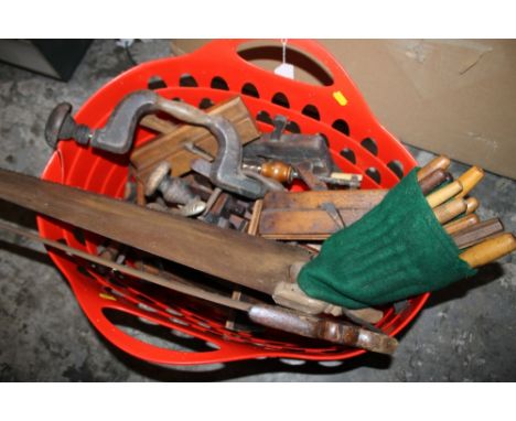 A BASKET OF WOODWORKING TOOLS TO INCLUDE PLANES, SAWS ETC