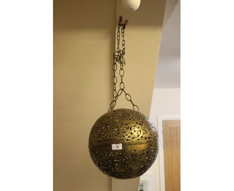 AN EASTERN BRASS GLOBULAR LIGHT FITTING;