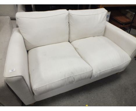 A SMALL MODERN UPHOLSTERED 2 SEATER SOFA L-146 CM