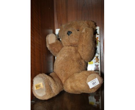 A VINTAGE MERRYTHOUGHT TEDDY BEAR TOGETHER WITH THE ULTIMATE TEDDY BEAR BOOK