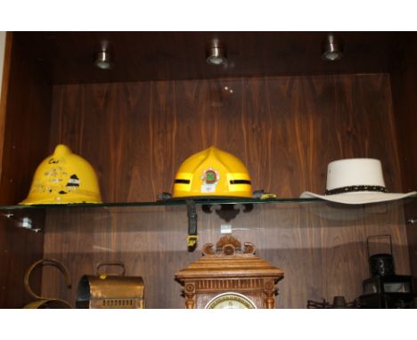 A STAFFORDSHIRE FIRE AND RESCUE SERVICE HELMET TOGETHER WITH ANOTHER PLUS A MODERN WESTERN EXPRESS INC COWBOY HAT (3)