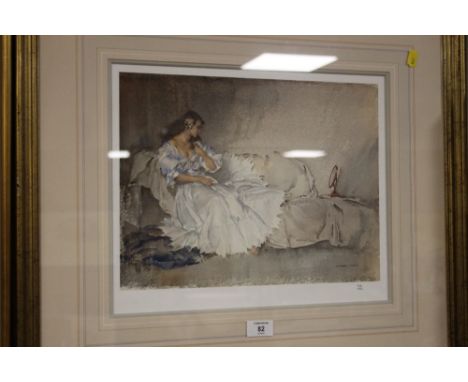 A FRAMED AND GLAZED LIMITED EDITION RUSSELL FLINT PRINT OF A WOMAN ON A SOFA - NUMBER 602/850