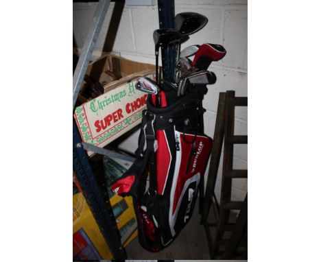 A DUNLOP GOLF BAG WITH CLUBS