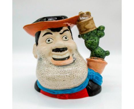 Glazed, hand painted ceramic. Based on the 1937 British comic "The Dandy". The wild west character is in a red shirt, black v