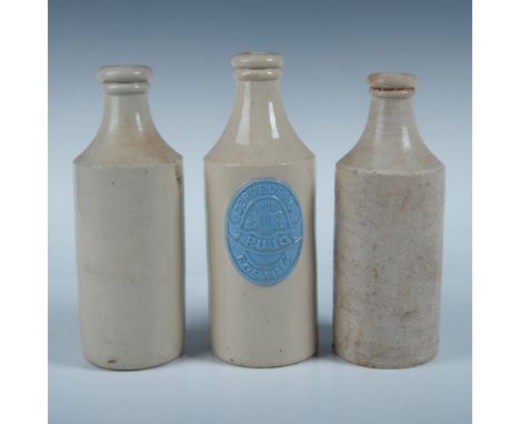 This charming grouping consists of three bottles. One is marked with the stamp Port Dagas, the second is unmarked, and the th