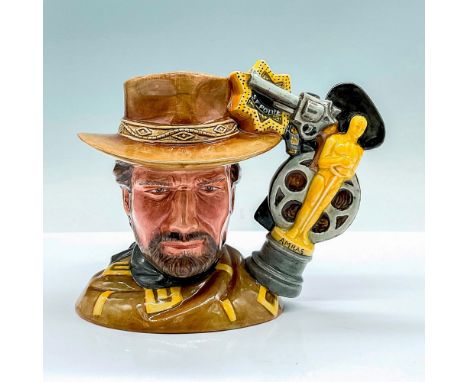 A rare figure jug of fame movie star, Clint Eastwood. Handle is a collection of his props and awards. Royal Doulton, The Prop