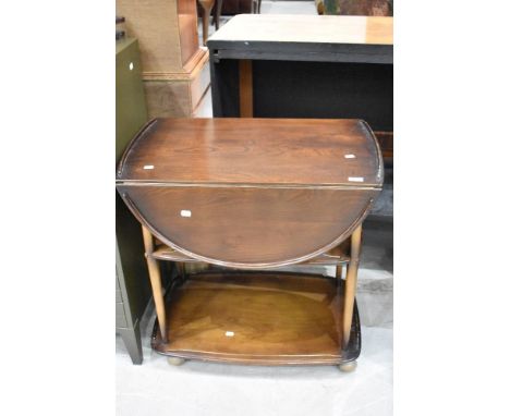 An Ercol tea trolley, dark stain finish