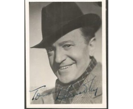 Tommy Handley signed photo. Small 6 x 8cm black and white portrait photograph signed by comedian Tommy Handley 1892 1949. He 