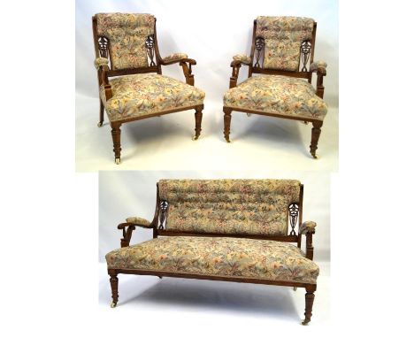 A good quality Victorian carved and pierced walnut framed three piece salon suiteThe elegant show wood framed re-upholstered 