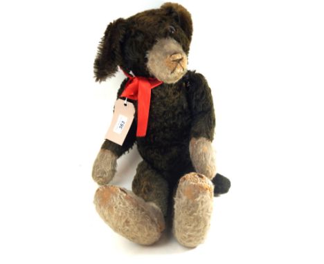 A black/brown and white mohair 'Pip' dog, probably by Farnell, British, 1920sClear glass eye with black pupil, incomplete bro