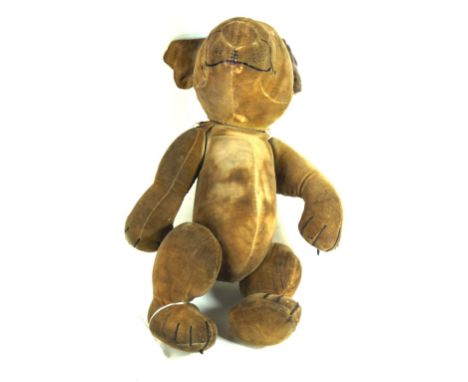 A Chad Valley felt Bonzo dog With articulated head and limbs, painted in features with button to collar, Chad Valley 'Bonzo' 