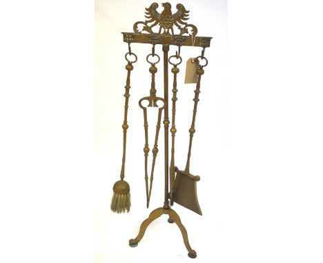 A Period-style brass fireside companion set, early 20th CenturyComprising a pair of tongs, a poker, a shovel and a brush, sus