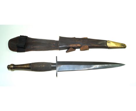 A Fairbairn-Sykes second pattern fighting knife, mid 20th Century18cm straight double edged blade, cross guard marked Sheffie