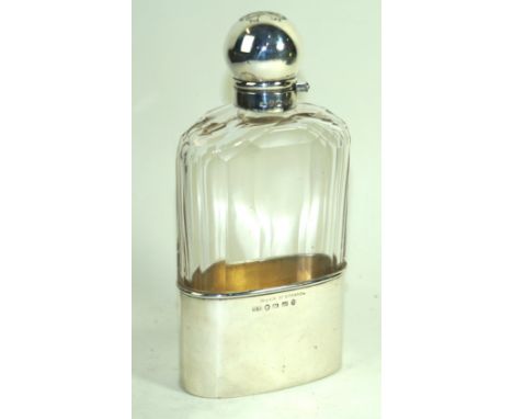 A Victorian hallmarked silver mounted bassett cut glass hip flask by George Unite Having a hinged and swivel bulbous top abov